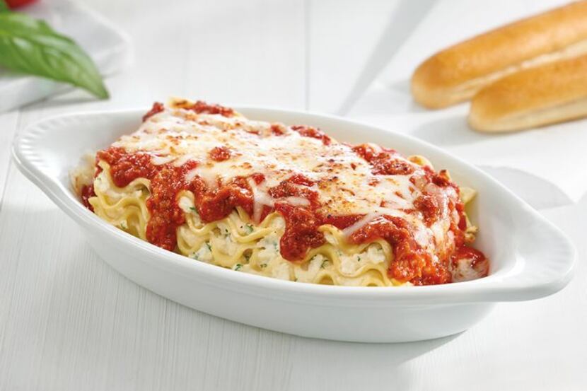 Fazoli's entrees such as lasagna are served with two hot breadsticks.