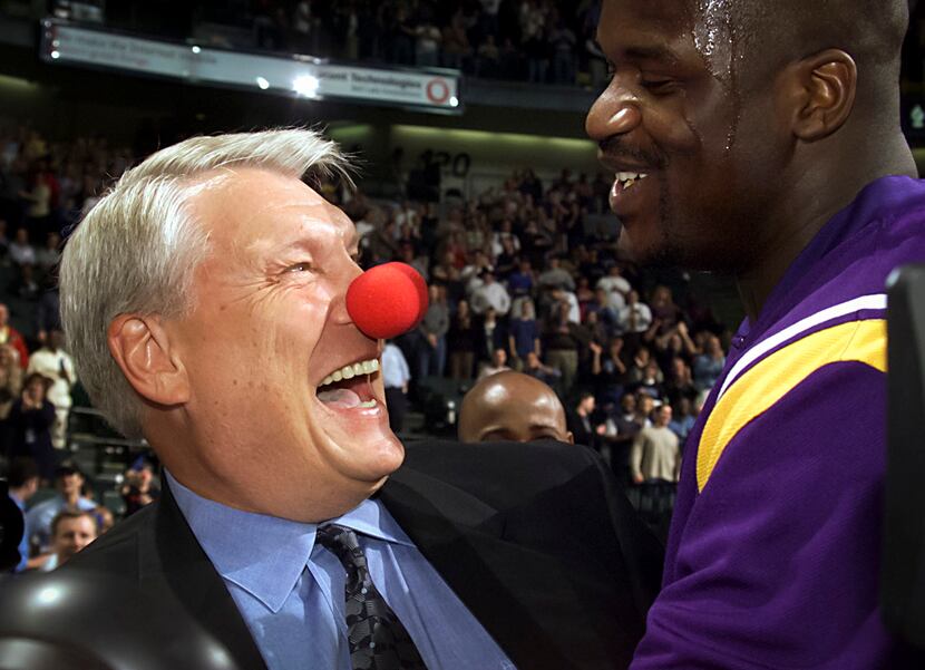Dallas Mavericks coach Don Nelson wears a clown nose as he laughs with the Los Angeles...