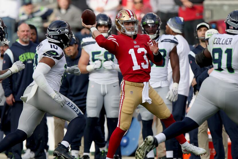 San Francisco 49ers quarterback Brock Purdy (13) throws during an NFL wild card playoff...