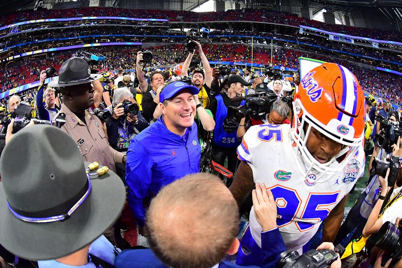 ATLANTA, GEORGIA - DECEMBER 29:  Head coach Dan Mullen of the Florida Gators celebrates...