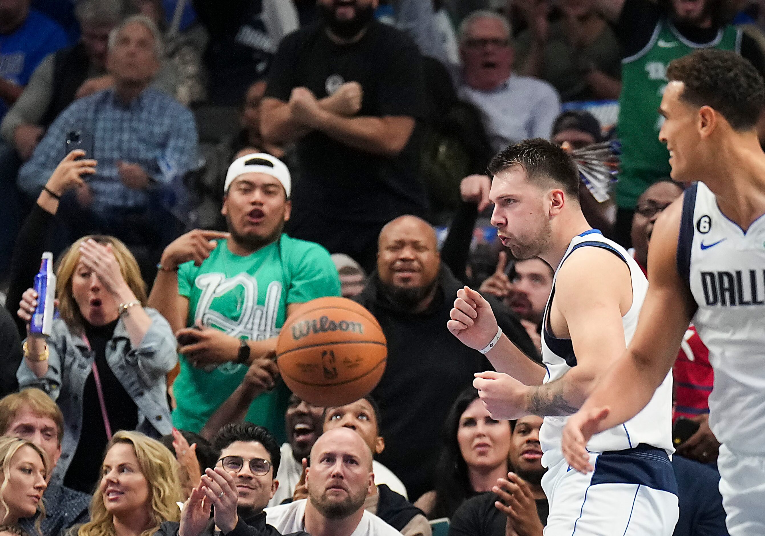 Dallas Mavericks guard Luka Doncic celebrates after scoring while being fouled during the...