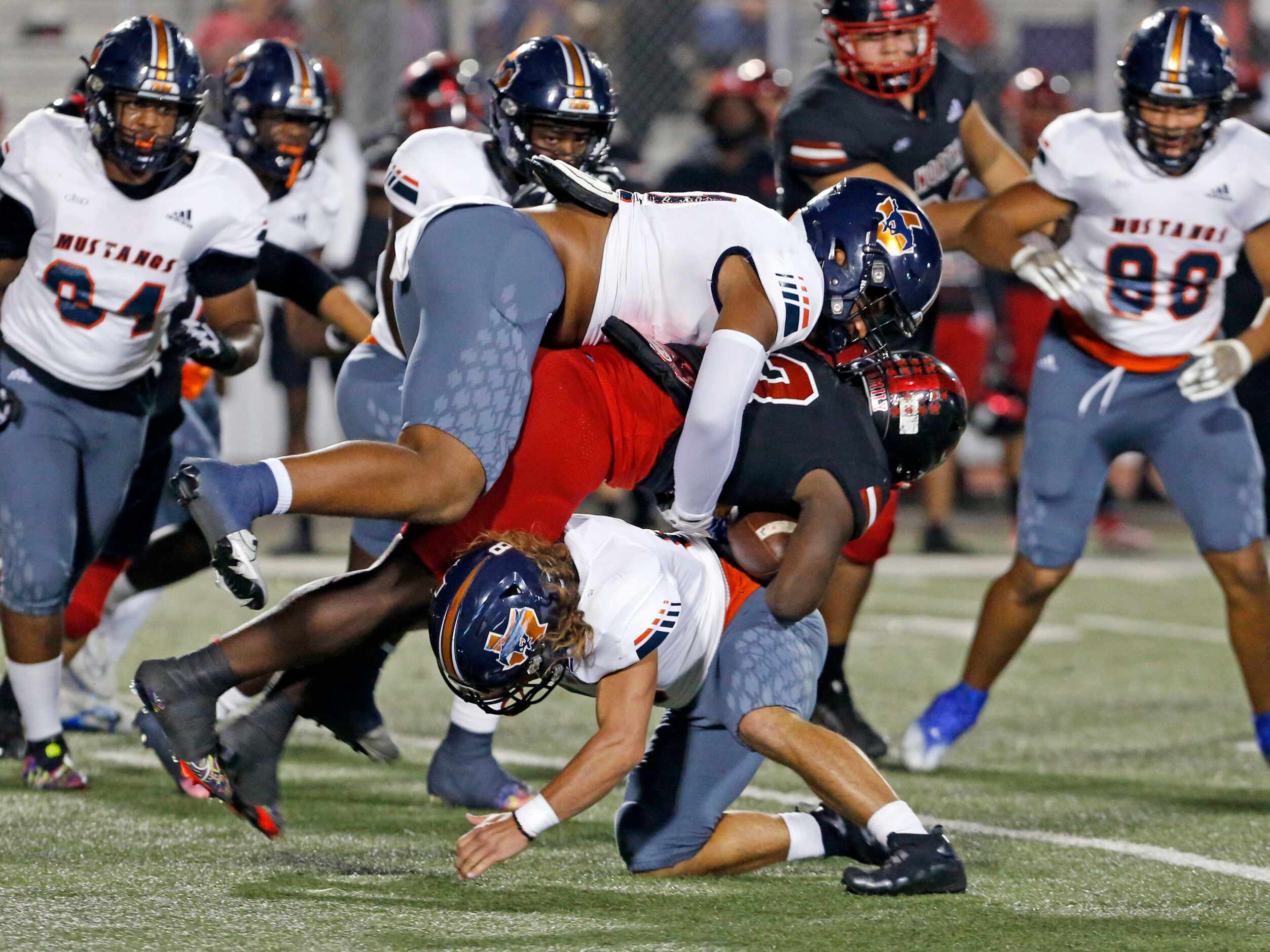 North Garland RB Jayden Davis (13) id sandwiched by two Sachse High defenders during the...