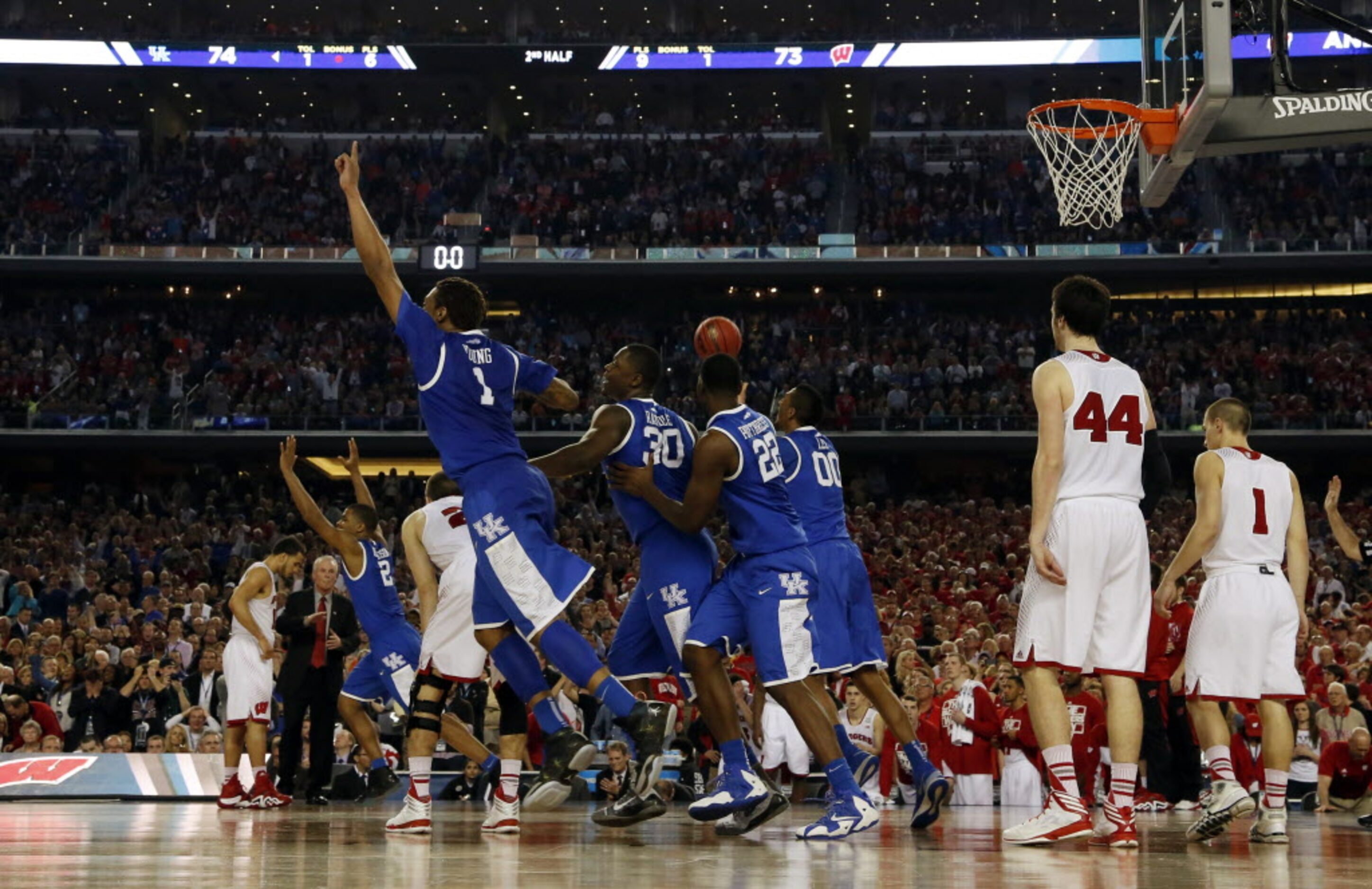 Kentucky Wildcats celebrates after a last second shot from Wisconsin Badgers guard Traevon...