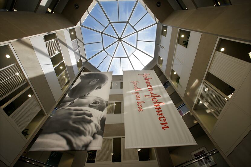 In this Tuesday, July 30, 2013, photo, large banners hang in an atrium at the headquarters...