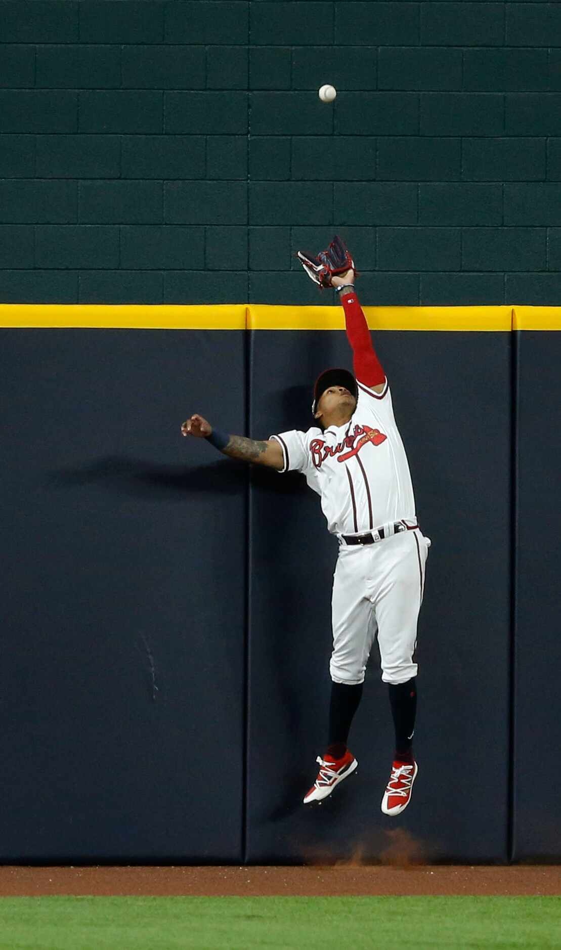 Atlanta Braves center fielder Cristian Pache (14) leaps in an attempt to catch a solo home...