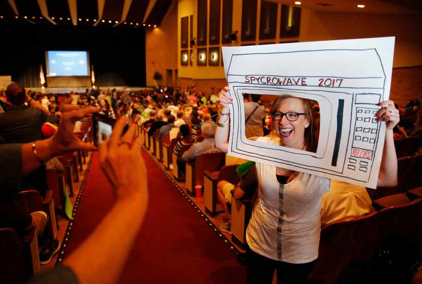 Alicia Coddington of Rowlett gets her photo taken before the start of a town hall meeting...