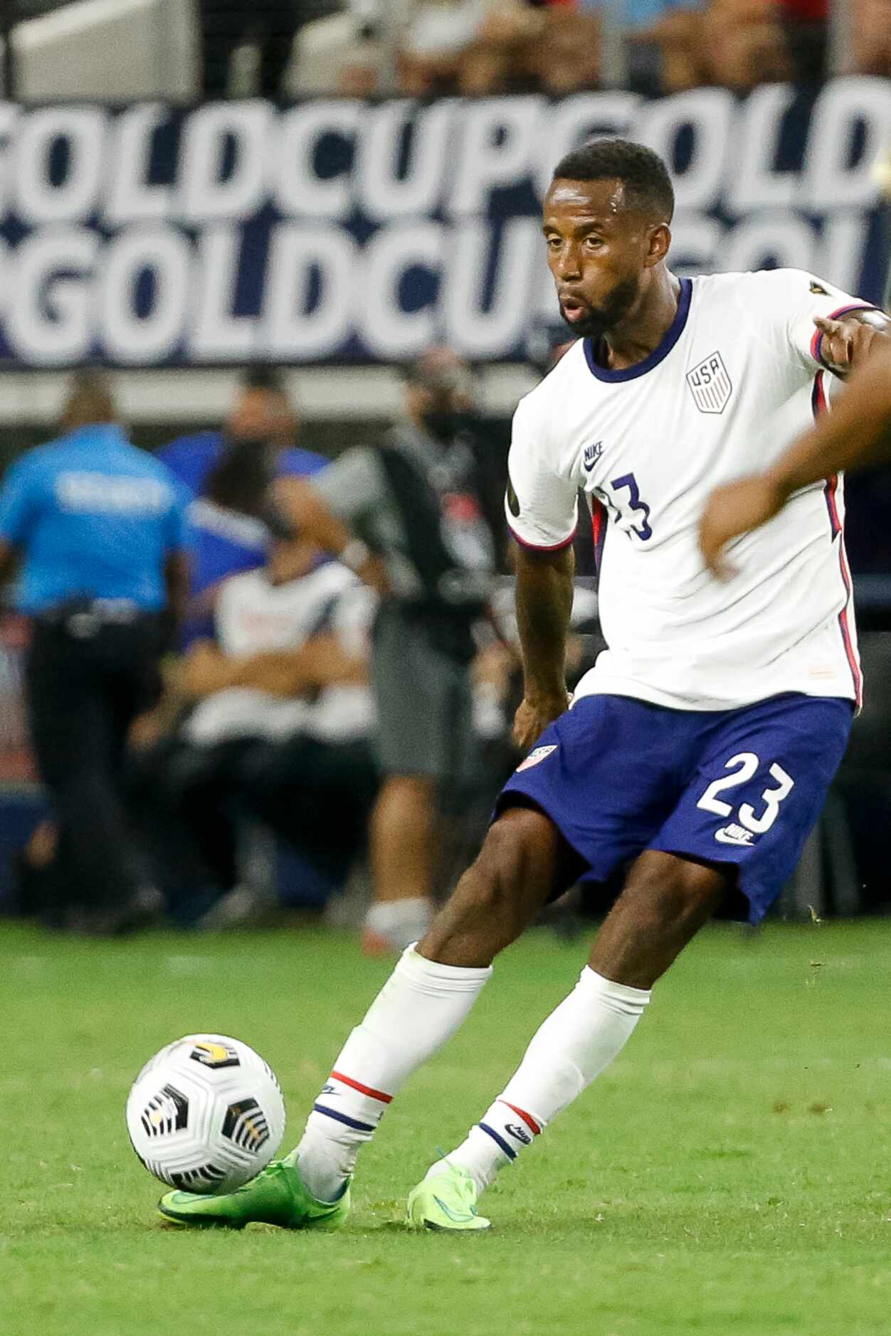 USA midfielder Kellyn Acosta (23) crosses the ball during the second half of a CONCACAF Gold...