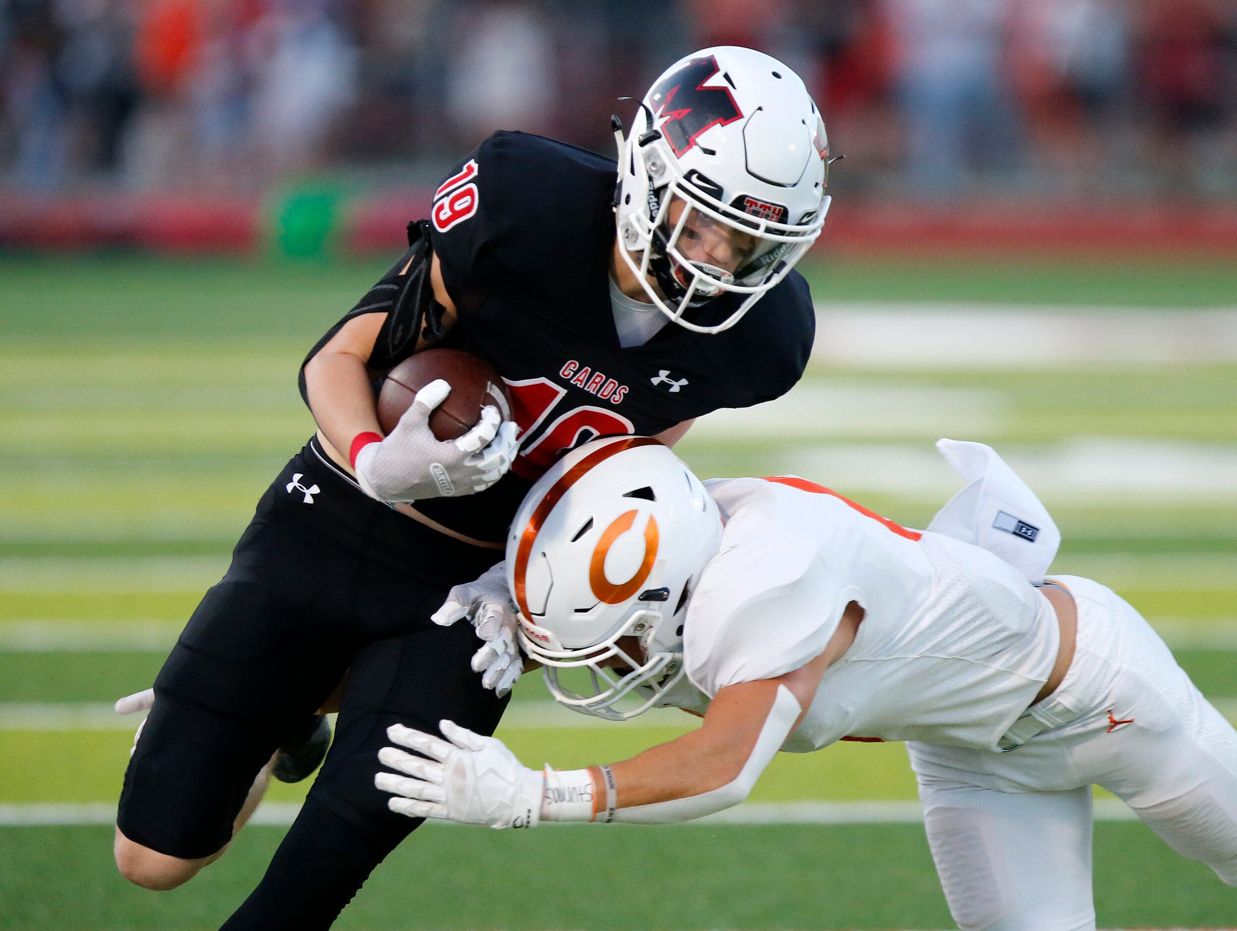 Melissa High School wide receiver Matthew Sanford (19) is tackled after the catch during the...