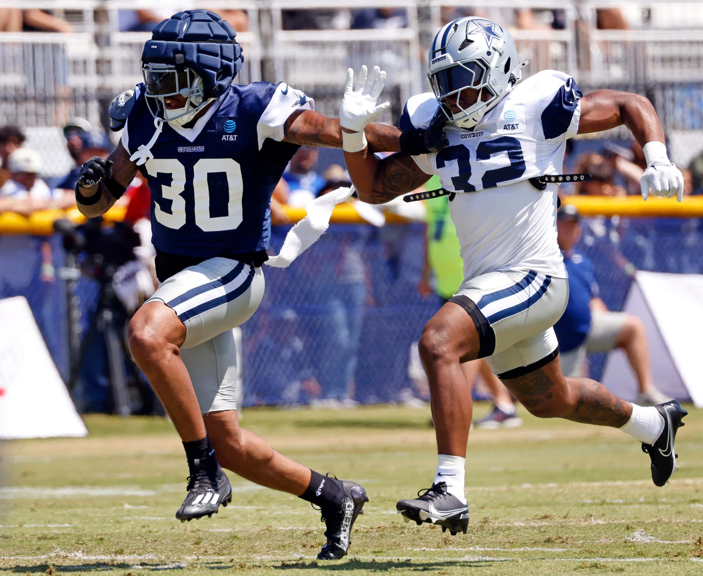 Dallas Cowboys safety Juanyeh Thomas (30) and running back Snoop Conner (32) race down field...