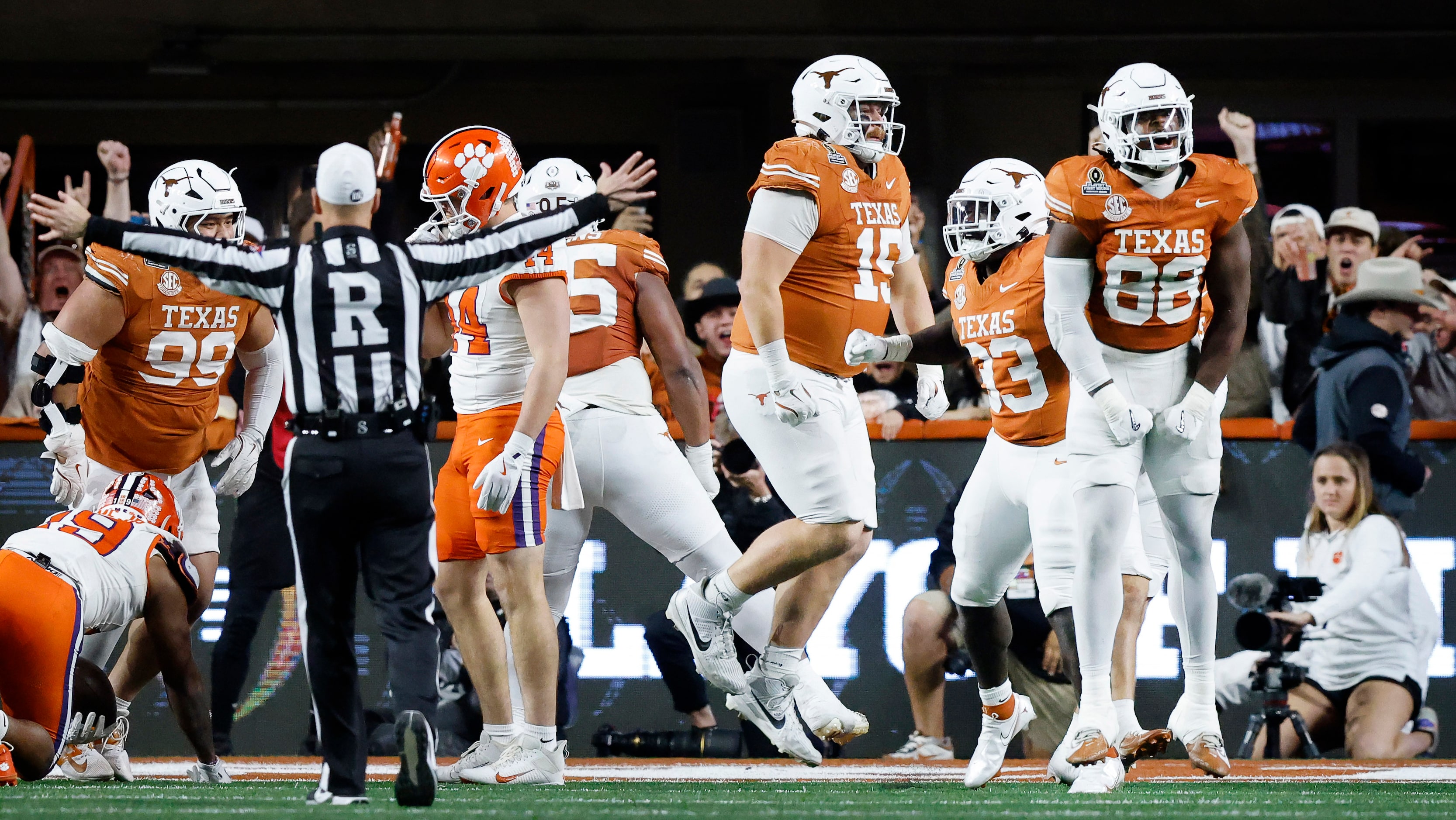 The Texas Longhorns defense celebrates a 4th down stop near the goal line late in the fourth...