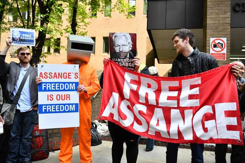 Supporters of WikiLeaks founder Julian Assange protest May 1, 2019, outside court in London,...