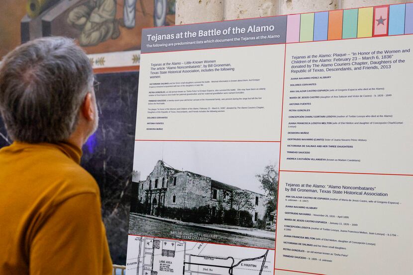 A person views the “Tejanas at the Battle of the Alamo” exhibit hosted by The Mexican...