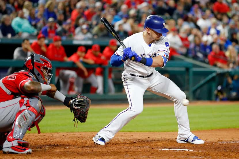 Texas Rangers left fielder Ryan Rua (16) struck out looking to end the fourth inning as Los...