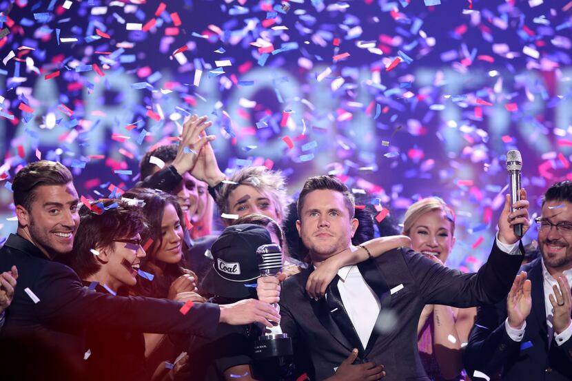 Trent Harmon, center, winner of "American Idol" The Farewell Season celebrates with fellow...