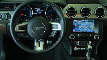 
The interior of the 2015 Ford Mustang offers an appropriate cockpit feel to the front.
