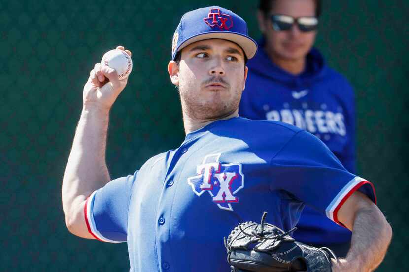 Texas Rangers minor league Ryan Garcia throws a pitch in the bullpen during a spring...