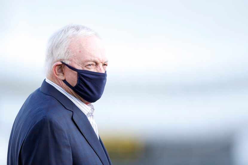 Dallas Cowboys owner and general manager Jerry Jones makes his way onto the practice field...