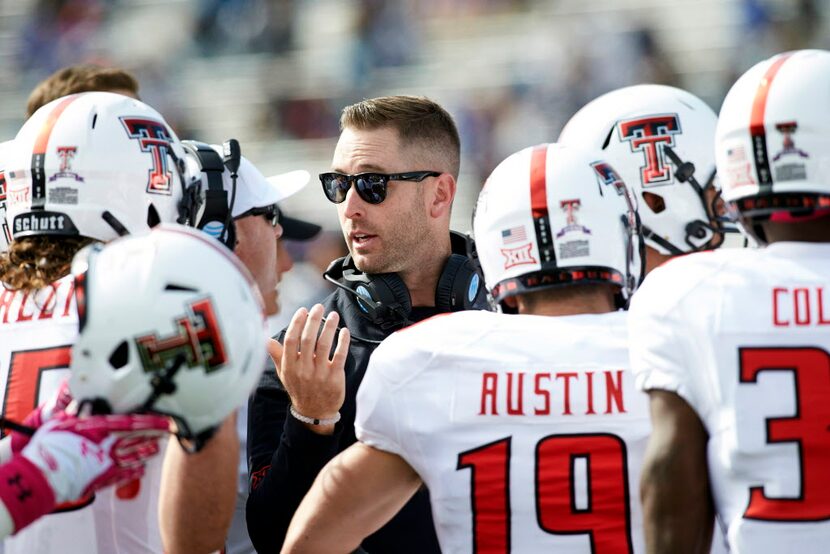 Oct 17, 2015; Lawrence, KS, USA; Texas Tech Red Raiders head coach Kliff Kingsbury talks to...