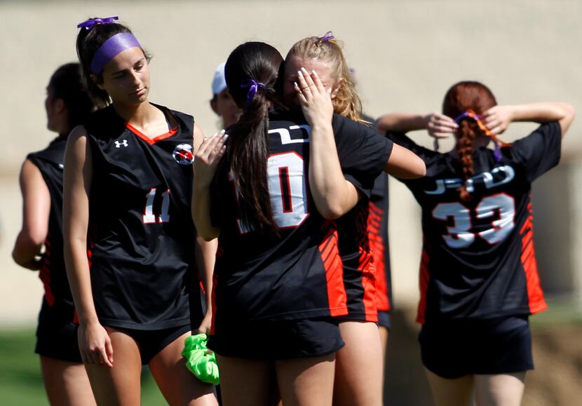  Rockwall players console each other following the team's season ending 1-0 loss to Austin...