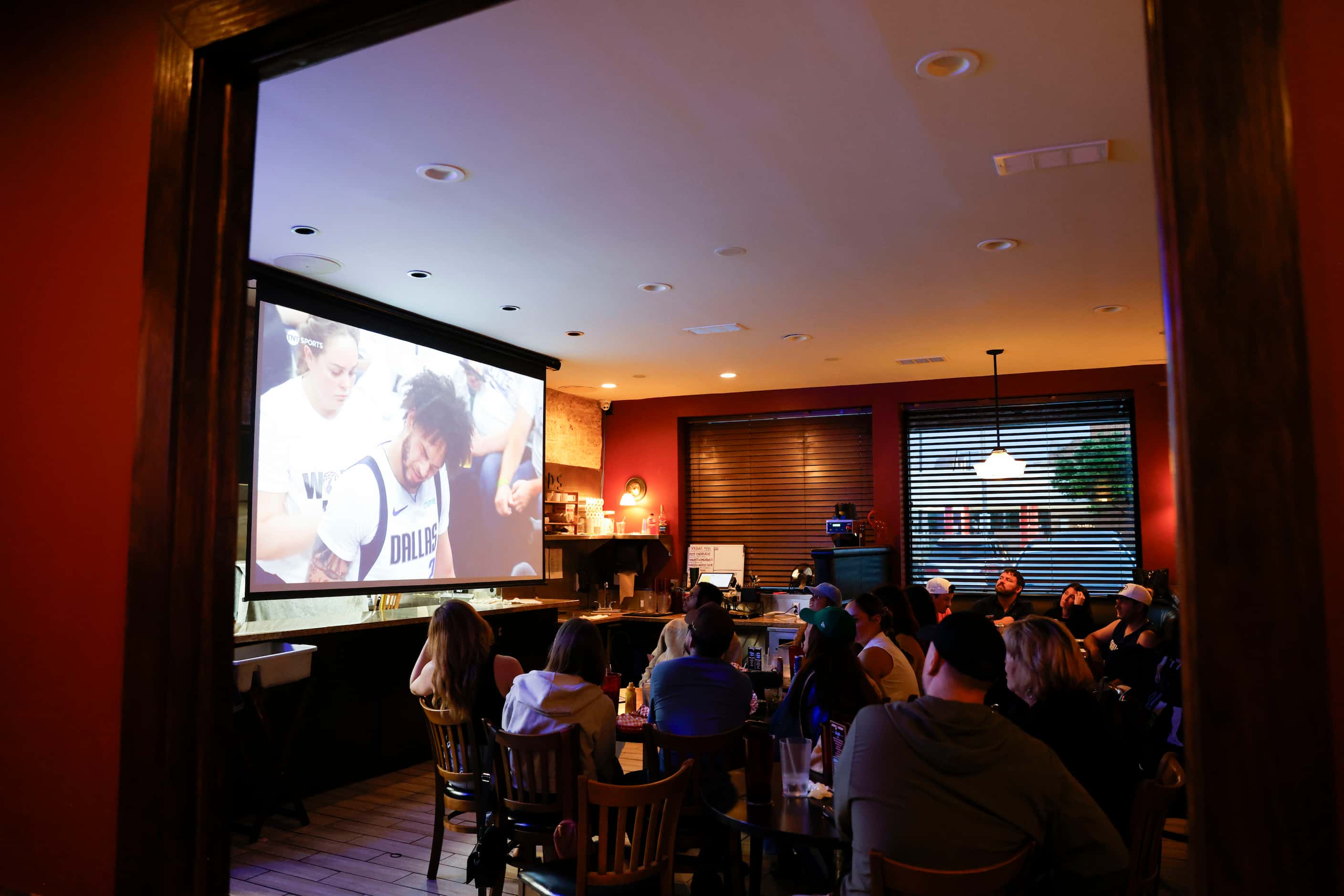 Customers watch a Dallas Mavericks playoff game at the new Stoneleigh P.