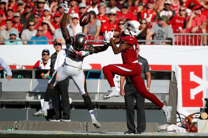 FILE - Buccaneers defensive back Jamel Dean (35) breaks up a pass intended for Cardinals...