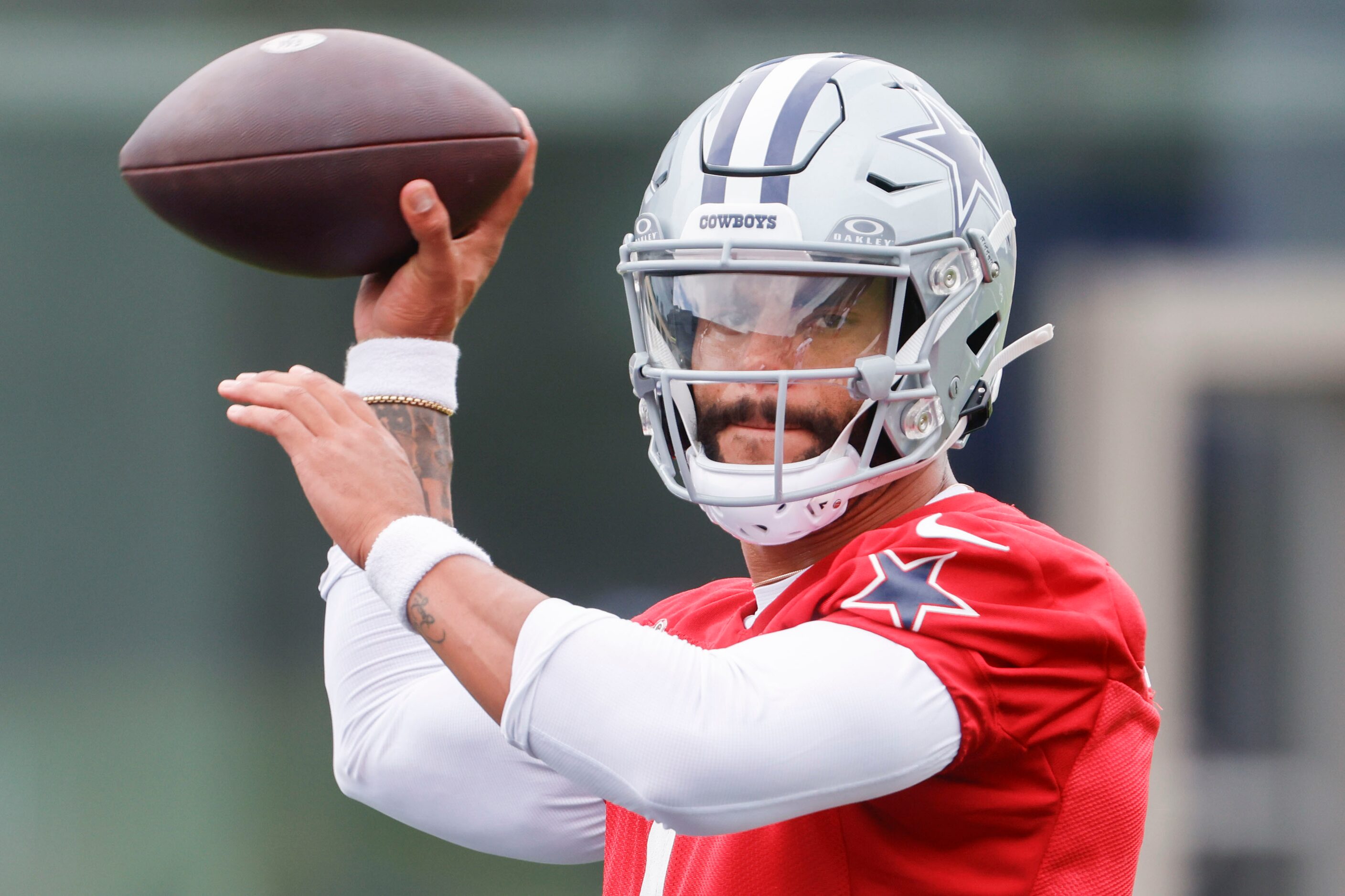 Dallas Cowboys quarterback Dak Prescott (4) throws the ball during a team practice, on...