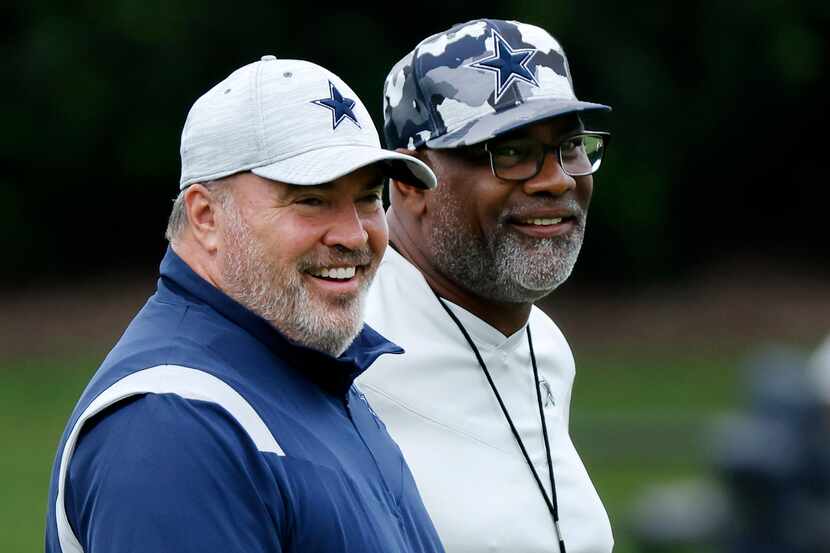 Dallas Cowboys head coach Mike McCarthy (left) and assistant head coach Rob Davis watch...