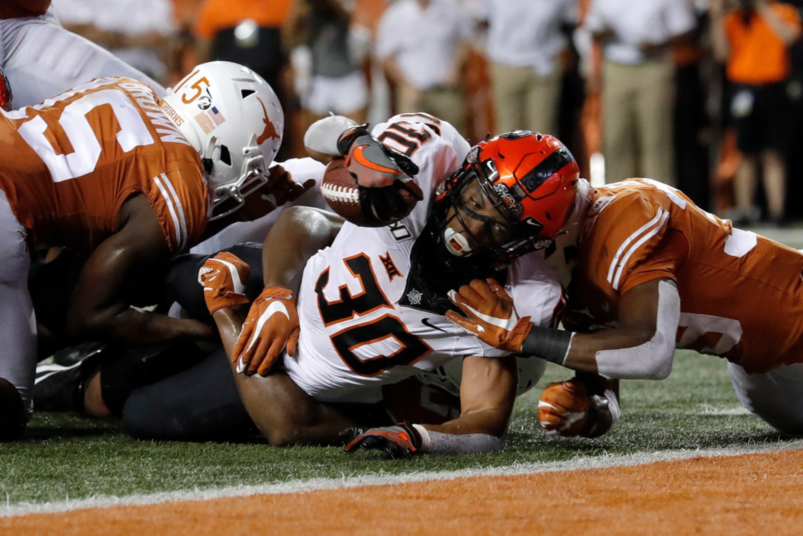 AUSTIN, TX - SEPTEMBER 21:  Chuba Hubbard #30 of the Oklahoma State Cowboys is stopped short...