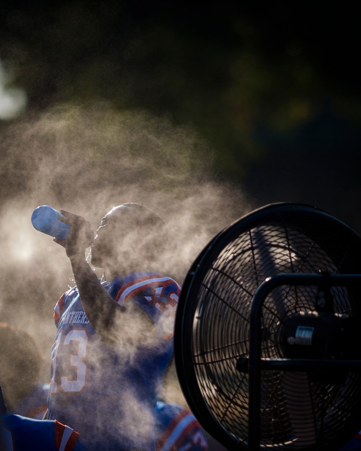 Duncanville wide receiver Roderick Daniels (13) cools off on the sidelines during the first...