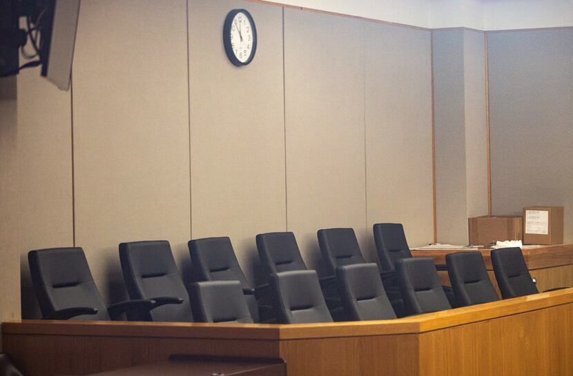 An empty jury box  at the Frank Crowley Courthouse.