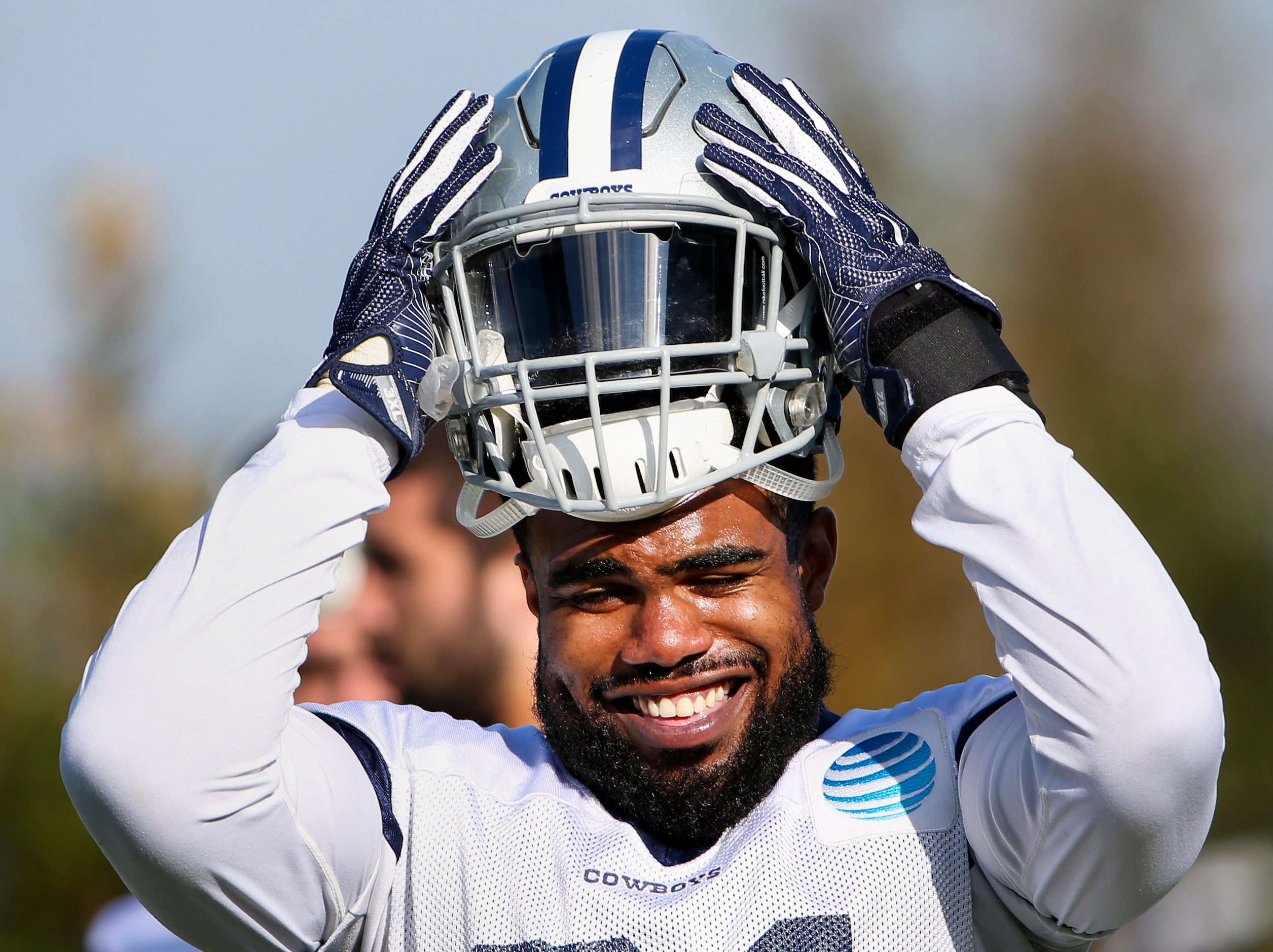 Dallas Cowboys running back Ezekiel Elliott (21) in between drills during team practice at...