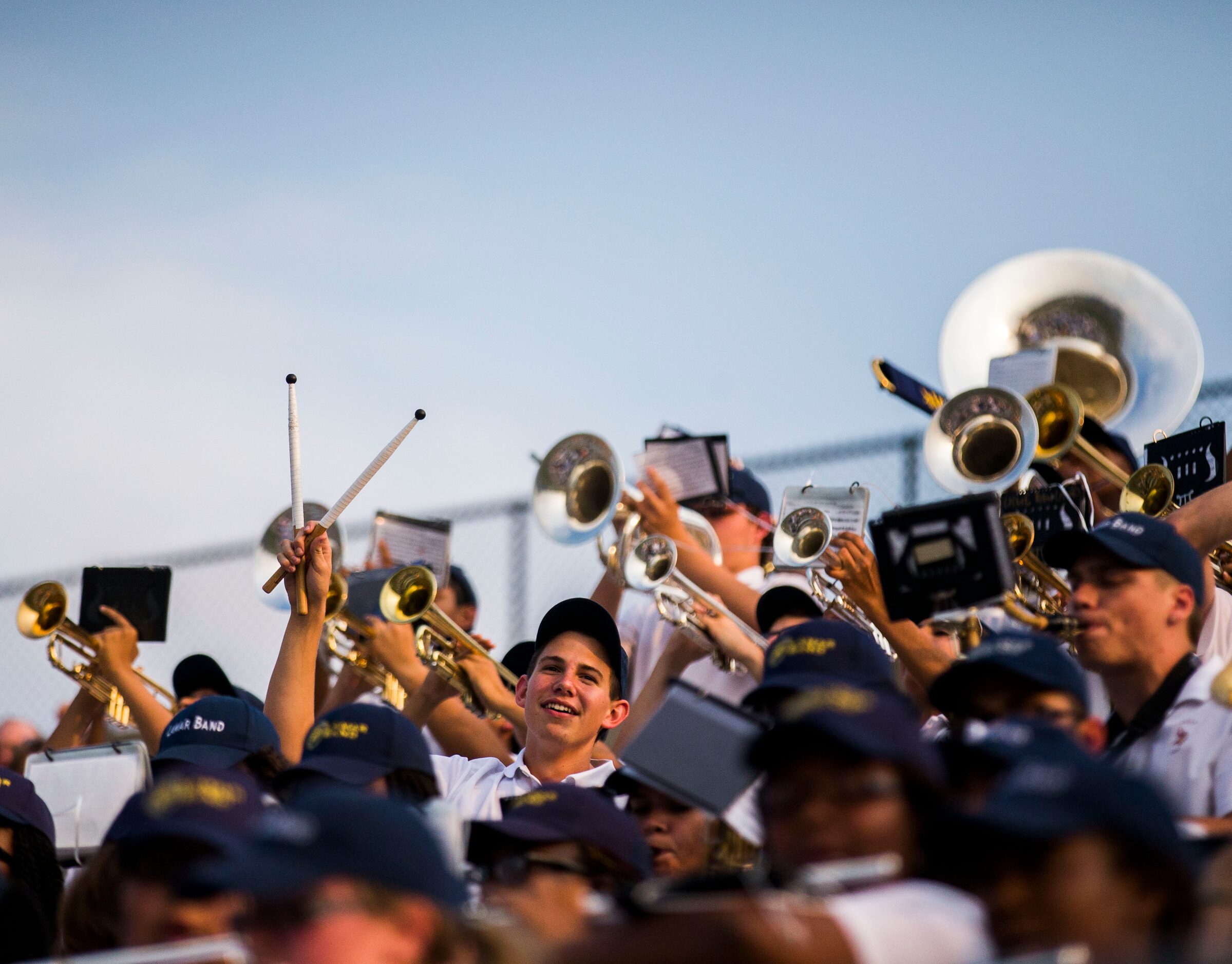 Arlington Lamar High School band sings their school song before their game against Richland...