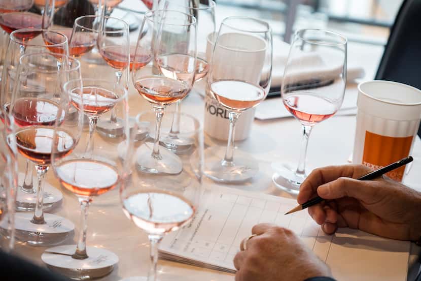 Judges taste wines at the TexSom International Wine Competition in Irving.