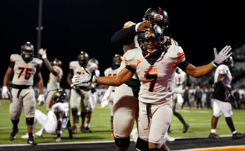 Lancaster running back Karon Neblett (7) celebrates his fourth quarter touchdown with...