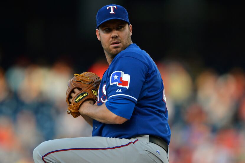 May 30, 2014; Washington, DC, USA; Texas Rangers starting pitcher Colby Lewis (48) pitches...