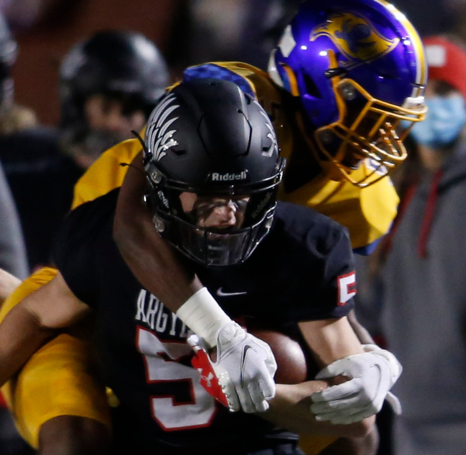 Argyle receiver Cole Kirkpatrick (5) is wrestled down by Waco LaVega defensive back Ja'von...