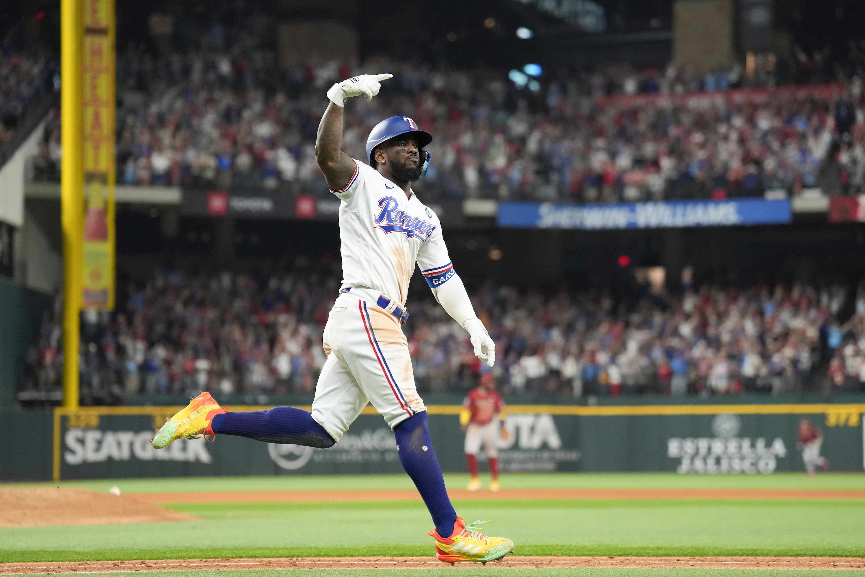 Texas Rangers' Adolis Garcia celebrates after hitting a walk-off home run during the...