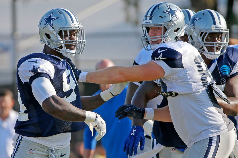 Dallas Cowboys defensive end Randy Gregory (94) practices with tight end Blake Jarwin (89)...