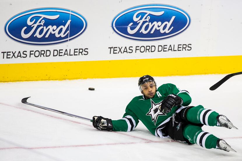 Dallas Stars defenseman Trevor Daley (6) is knocked to the ice setting of a brawl during the...