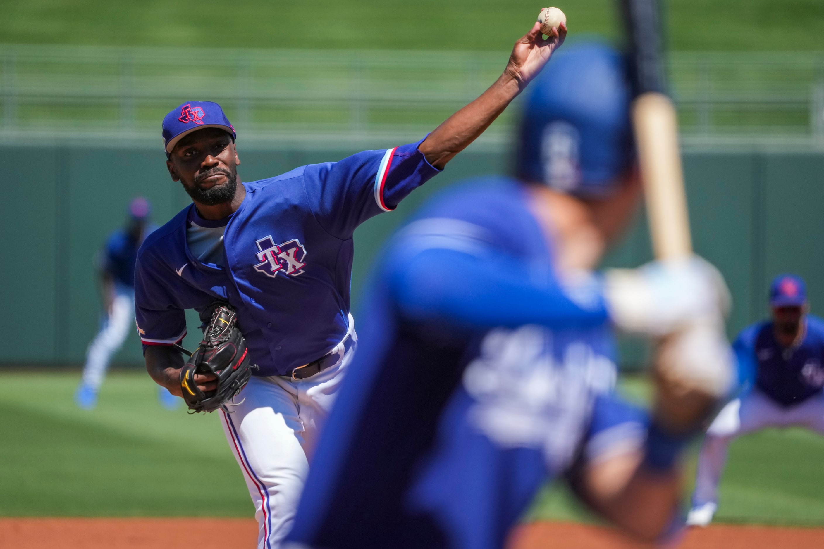 Texas Rangers pitcher Taylor Hearn delivers during the first inning of a spring training...