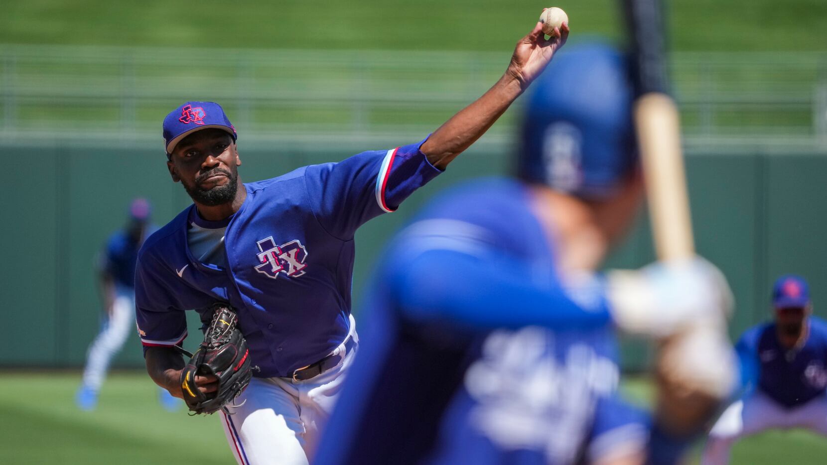 Texas Rangers pitcher Taylor Hearn delivers during the first inning of a spring training...