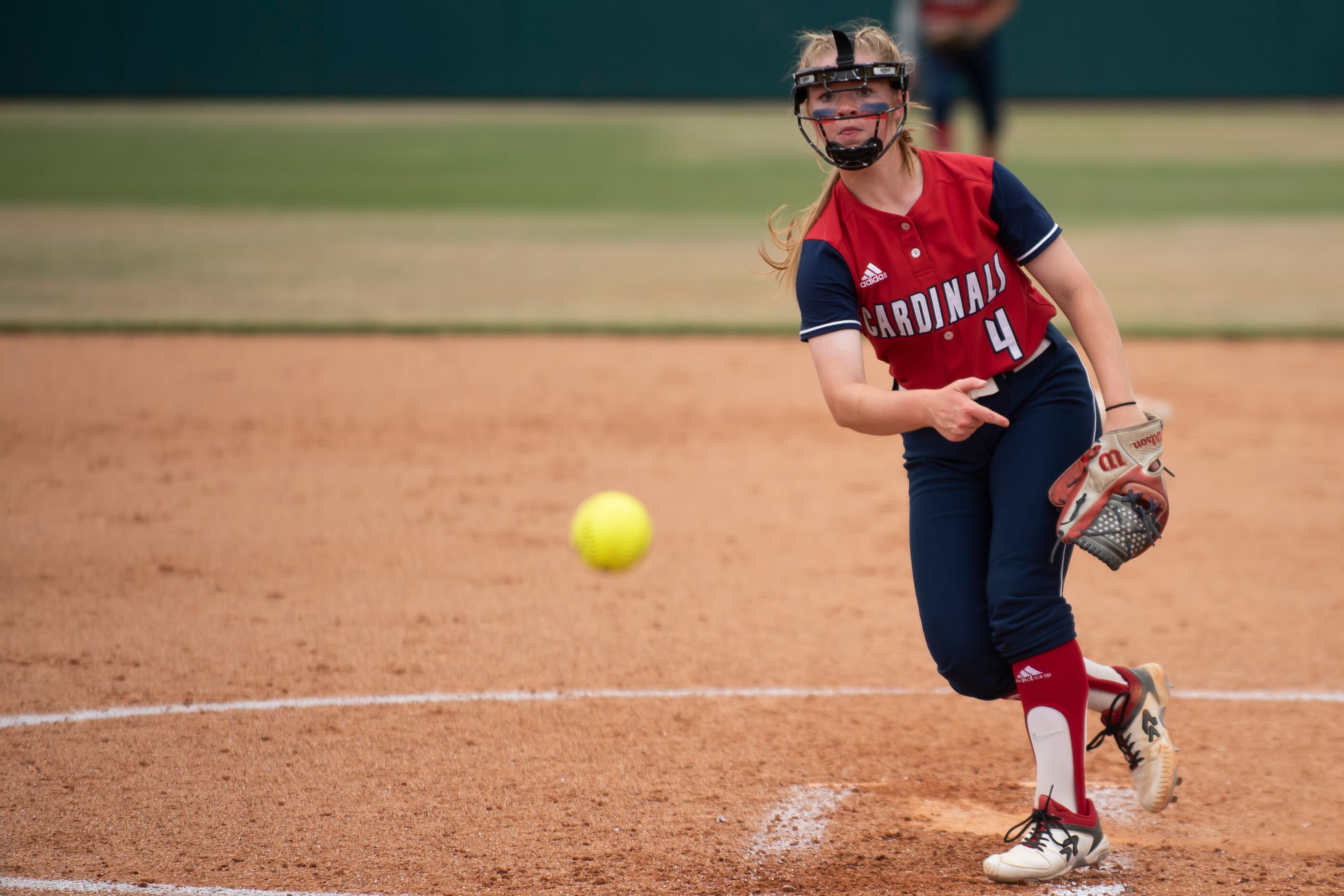 John Paul II freshman Carly Holman (4) delivers a pitch during the TAPPS Softball Division...