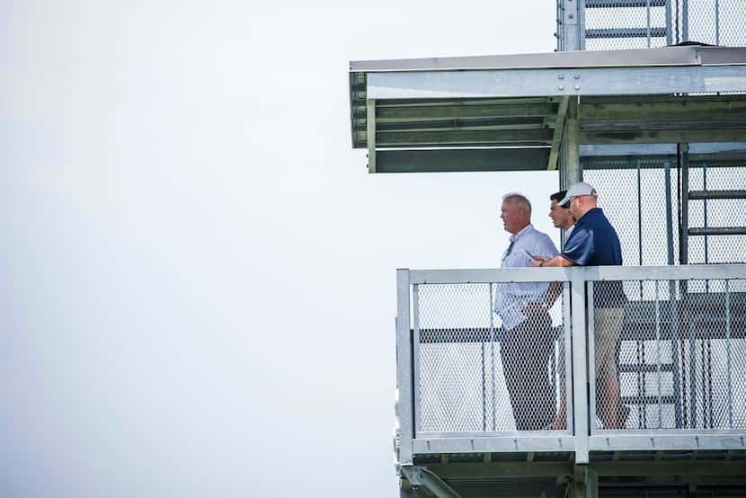 Dallas Cowboys executive vice president Stephen Jones (left) watches from a tower during the...