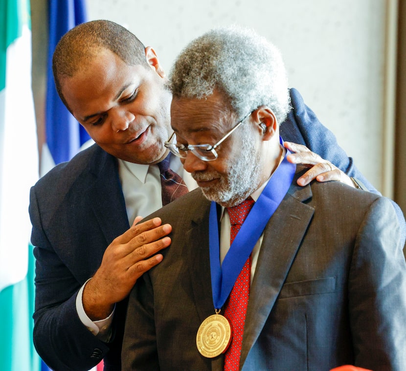 Dallas Mayor Eric Johnson (left) presents African-American Museum of Dallas founder Dr....