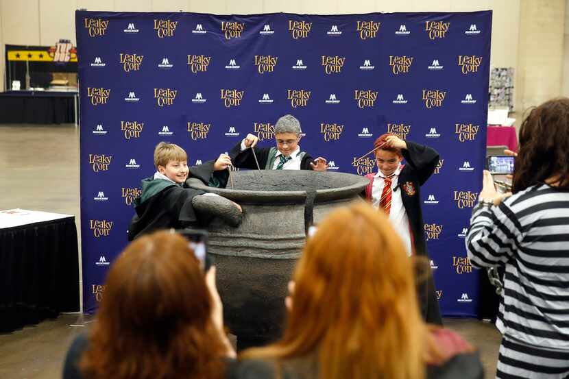 Young Harry Potter fans (from left) William Ferdinand, Travis Holmes and brother Simon...