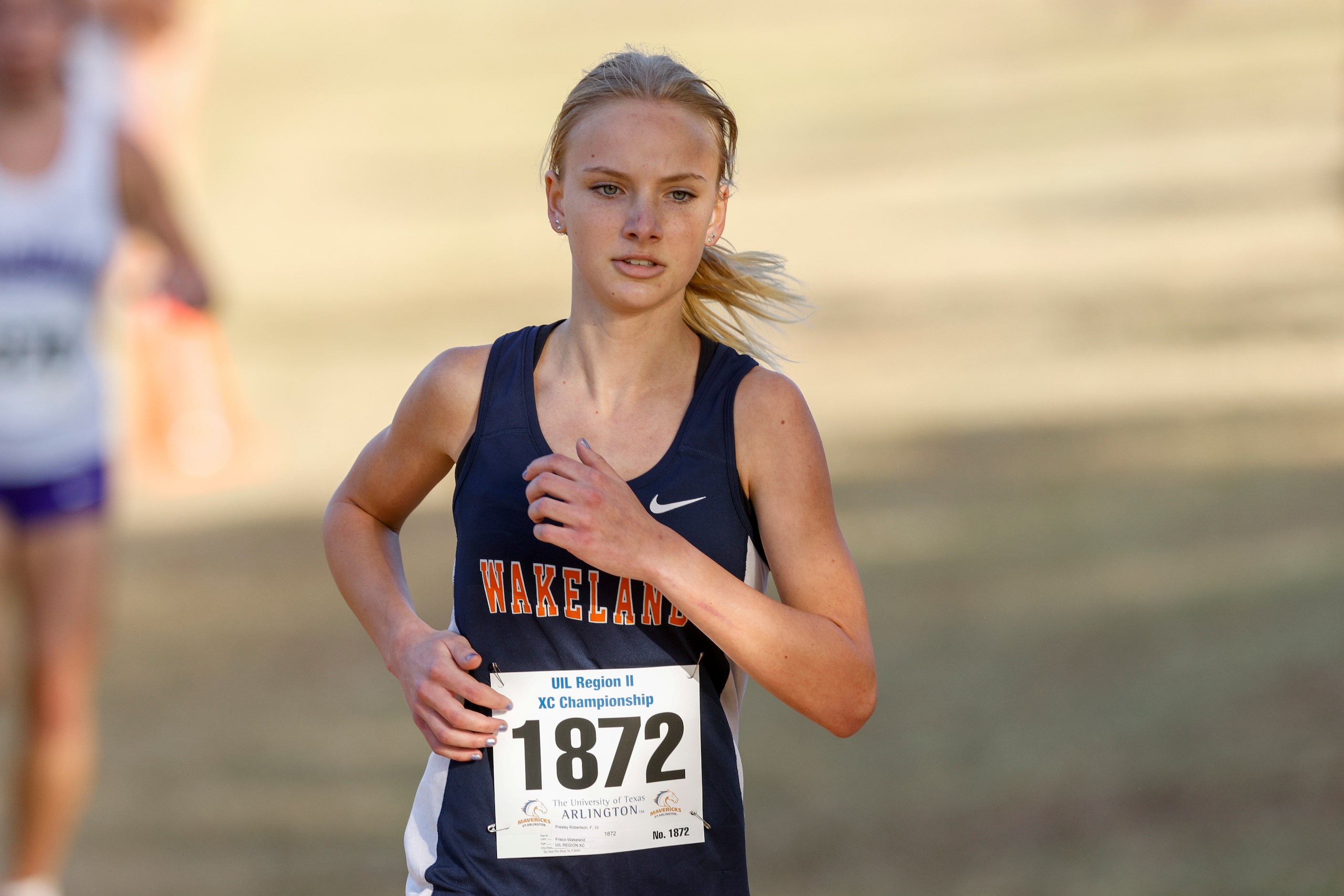 Frisco Wakeland’s Presley Robertson runs during the UIL Class 5A Region II cross country...