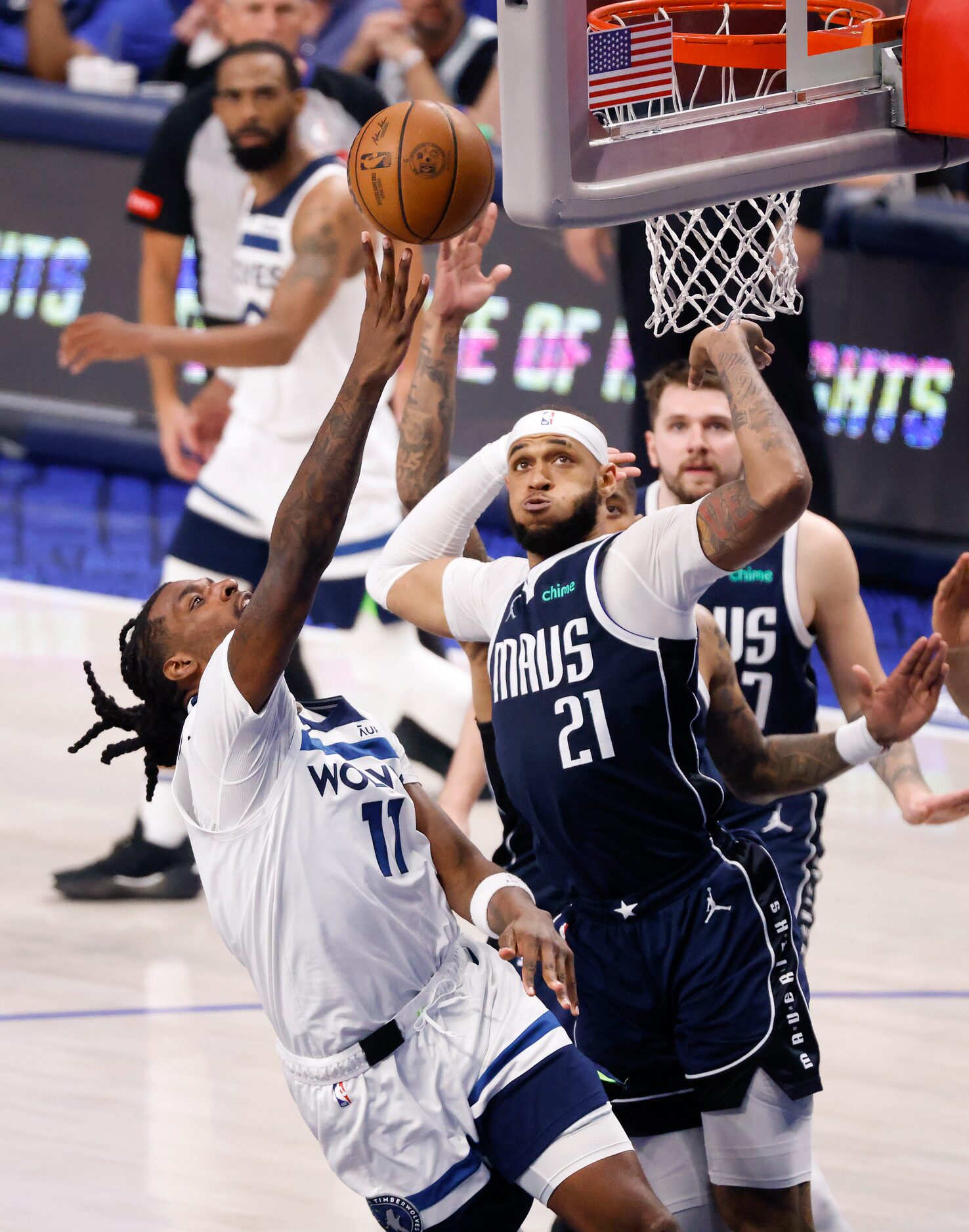 Minnesota Timberwolves center Naz Reid (11) makes a driving lay-up against Dallas Mavericks...