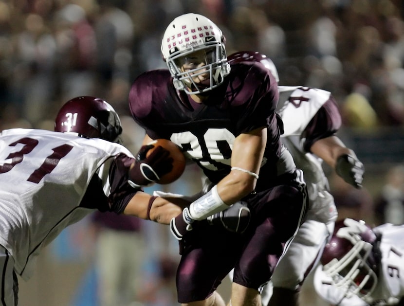 Plano running back Rex Burkhead  (20) cuts  between Mesquite outside linebacker Ben Robinson...