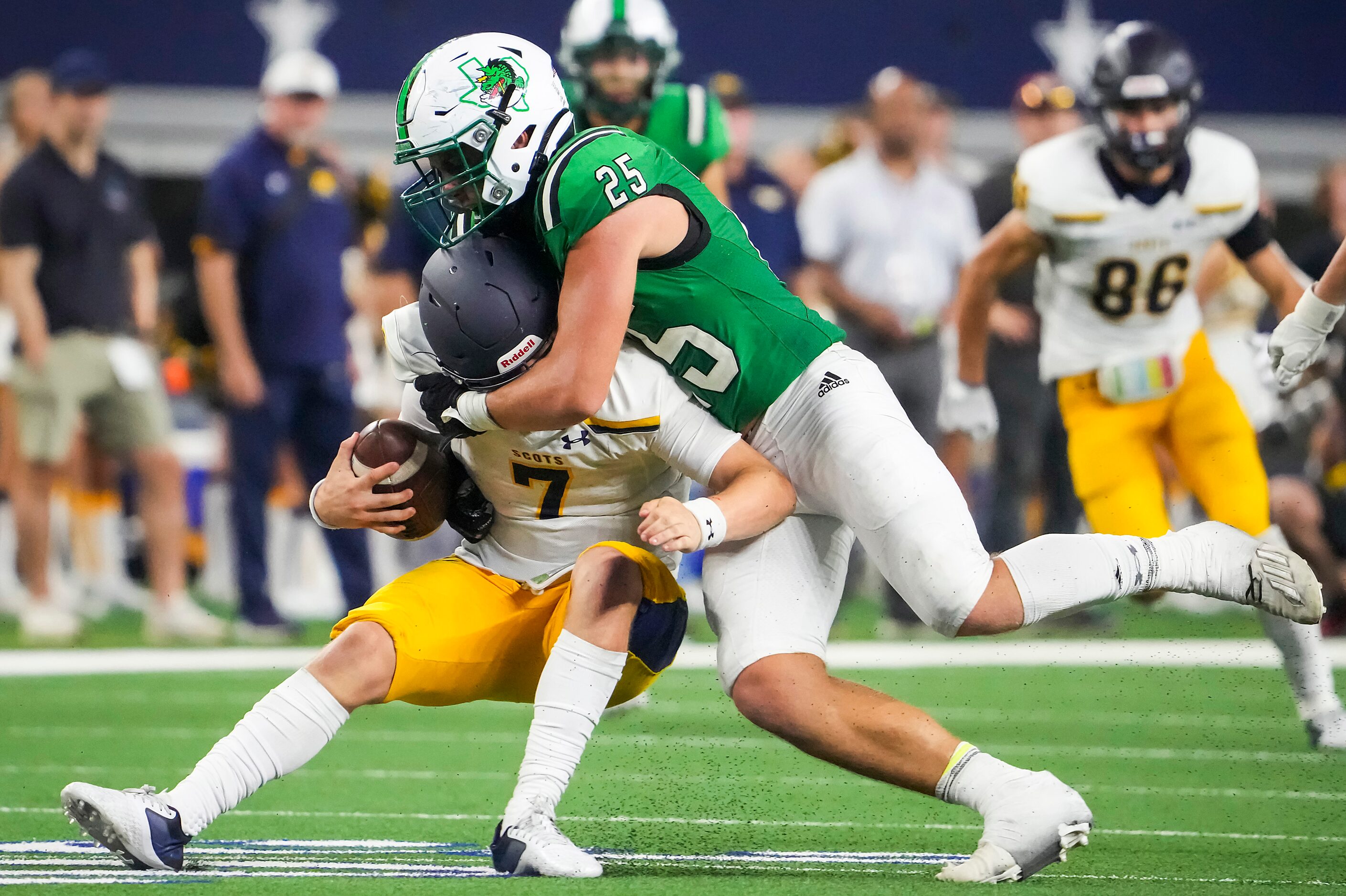 Highland Park quarterback Brennan Storer (7) is sacked by Southlake Carroll defensive...