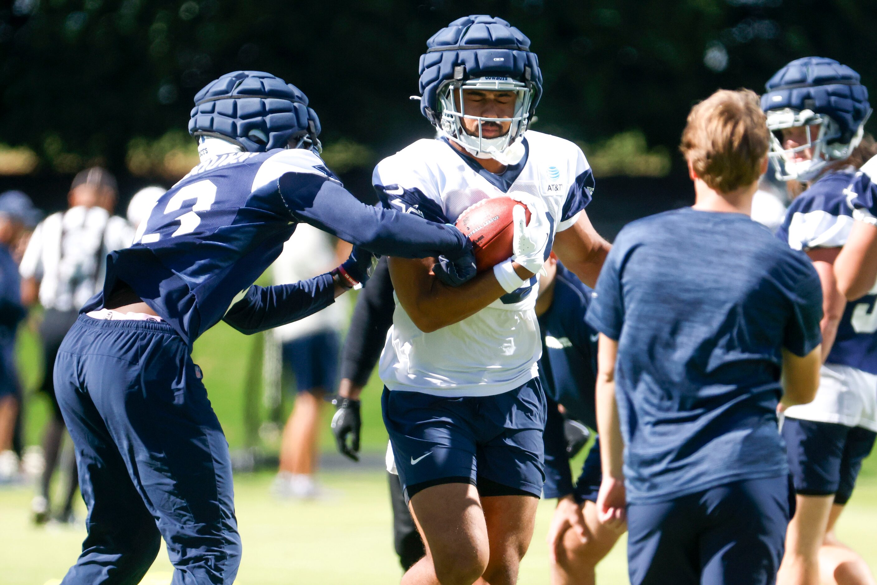 Dallas Cowboys linebacker DeMarvion Overshown (left) battles against Dallas Cowboys tight...